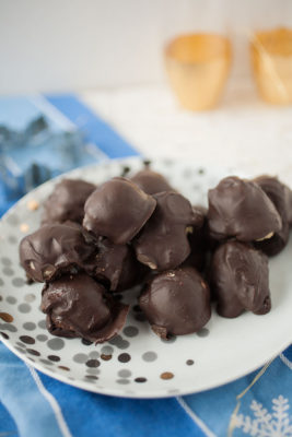 Easy to make no-bake cookie dough balls covered in cinnamon-flavored chocolate for the perfect, craveable holiday gift!