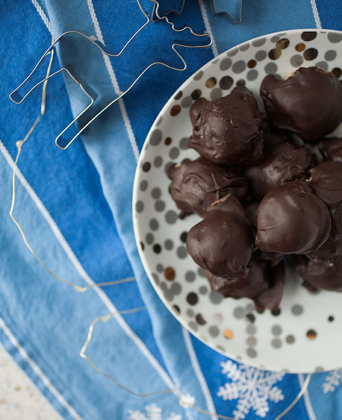 Easy to make no-bake cookie dough balls covered in cinnamon-flavored chocolate for the perfect, craveable holiday gift! 
