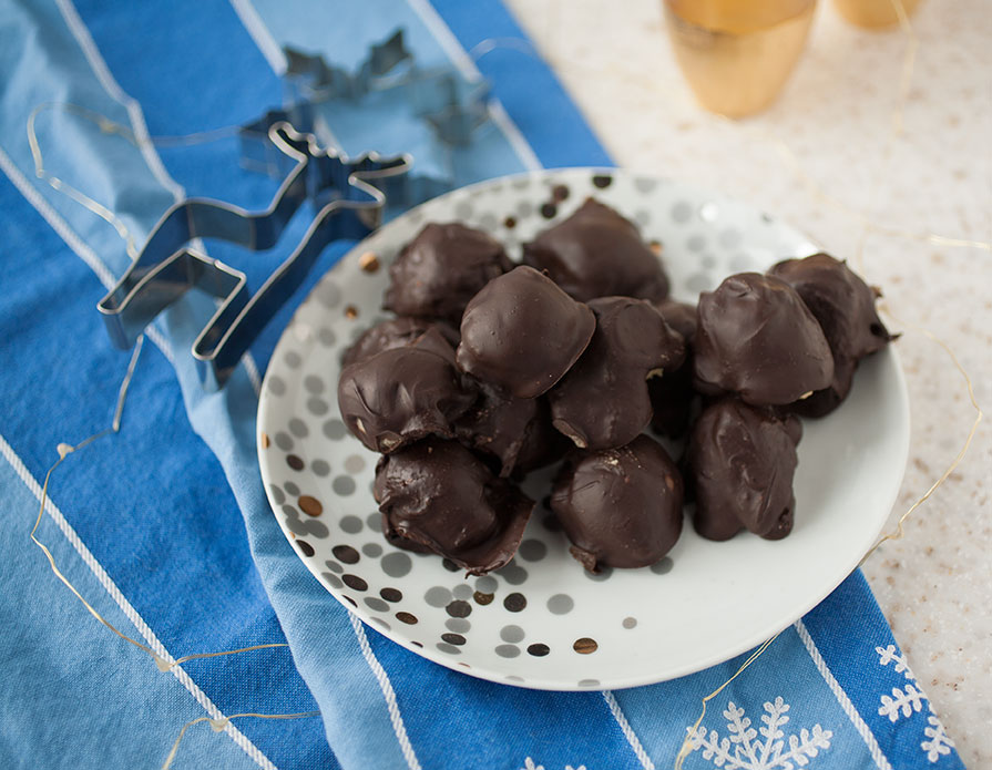 Easy to make no-bake cookie dough balls covered in cinnamon-flavored chocolate for the perfect, craveable holiday gift! 