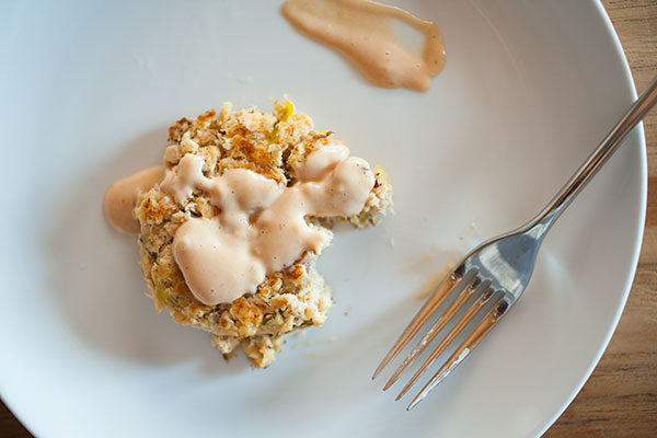 gluten-free salmon cake with bite taken out of it 