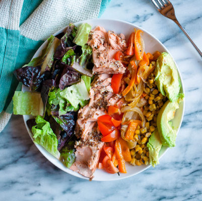 image of salmon salad with veggies on a white plate from Flurries of Flour 