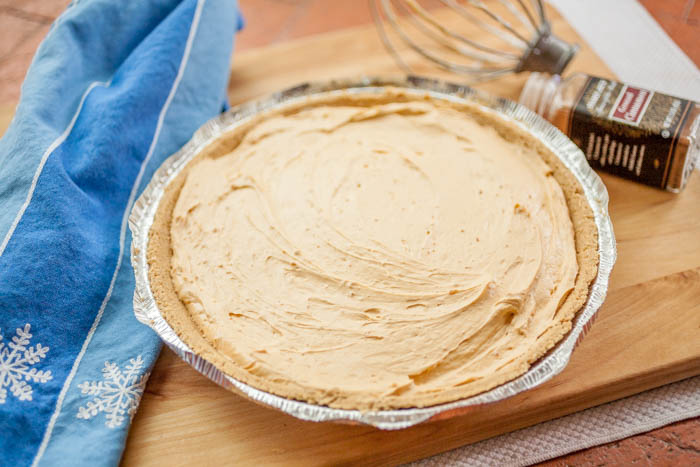 no-bake cheesecake with towel and whisk. 