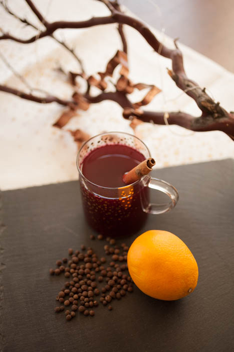 wassail in front of a branch and cookie cutter