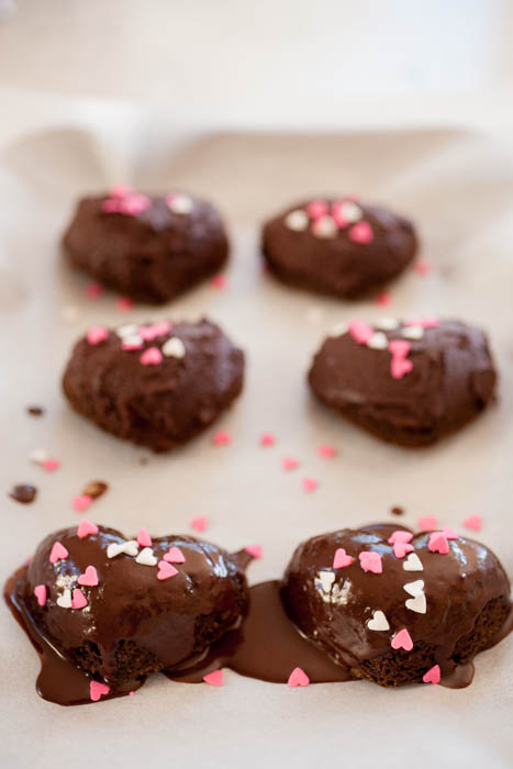 heart-shaped cakes with chocolate ganache and heart-shaped sprinkles 