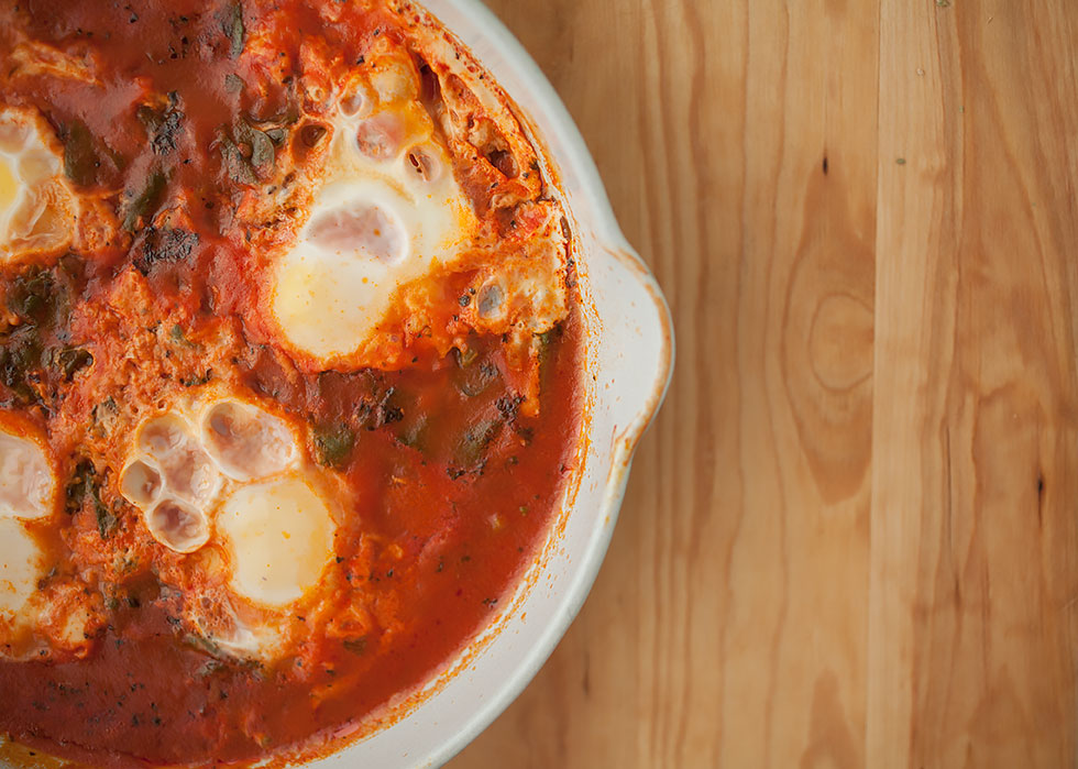 Silky, just-set eggs nestled in a savory tomato sauce—these savory baked eggs are heaven! They’re also done in under 30 minutes for a quick, healthy weeknight meal! 