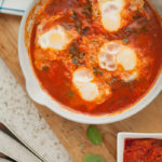 You can't go wrong with these delicious, savory baked eggs! Done in under 30-minutes, this hearty dish is the perfect, warming option for a meatless Monday breakfast, lunch, or dinner!