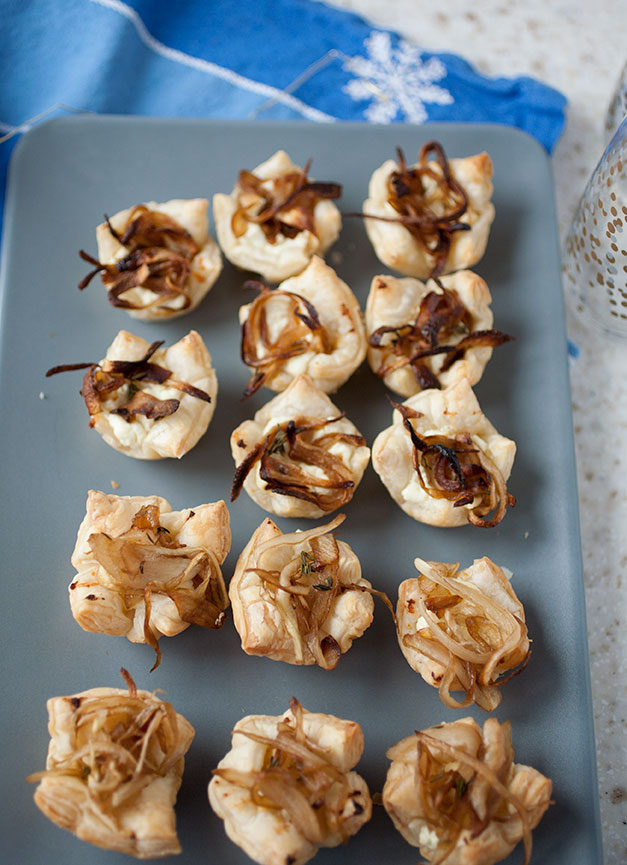 These caramelized onion and goat cheese tarts only require a handful of ingredients, aren’t very labor intensive, and the sweet-savory flavors meld perfectly in the flaky pastry crust! These holiday appetizers will fly off the plate!