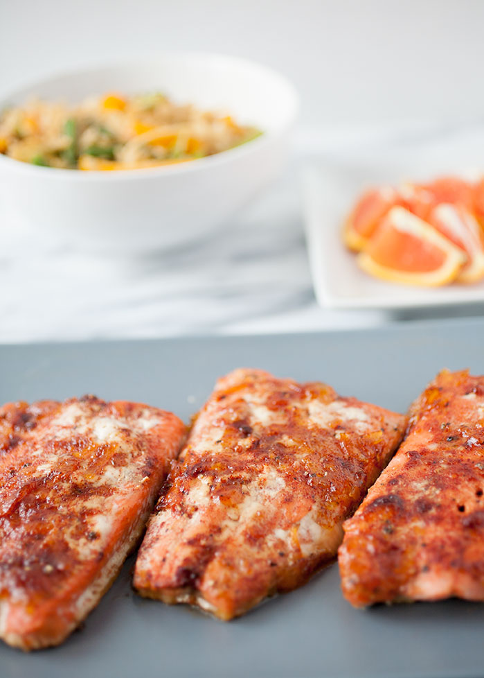 The orange and red chile in this orange red chile salmon adds a beautiful flavor and a spicy bite for a healthy and delicious New Year. 