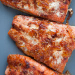 The orange and red chile in this orange red chile salmon adds a beautiful flavor and a spicy bite for a healthy and delicious for the New Year.