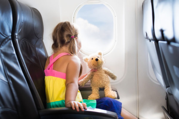 a child on a plane for traveling without the stress even when you're traveling with children.